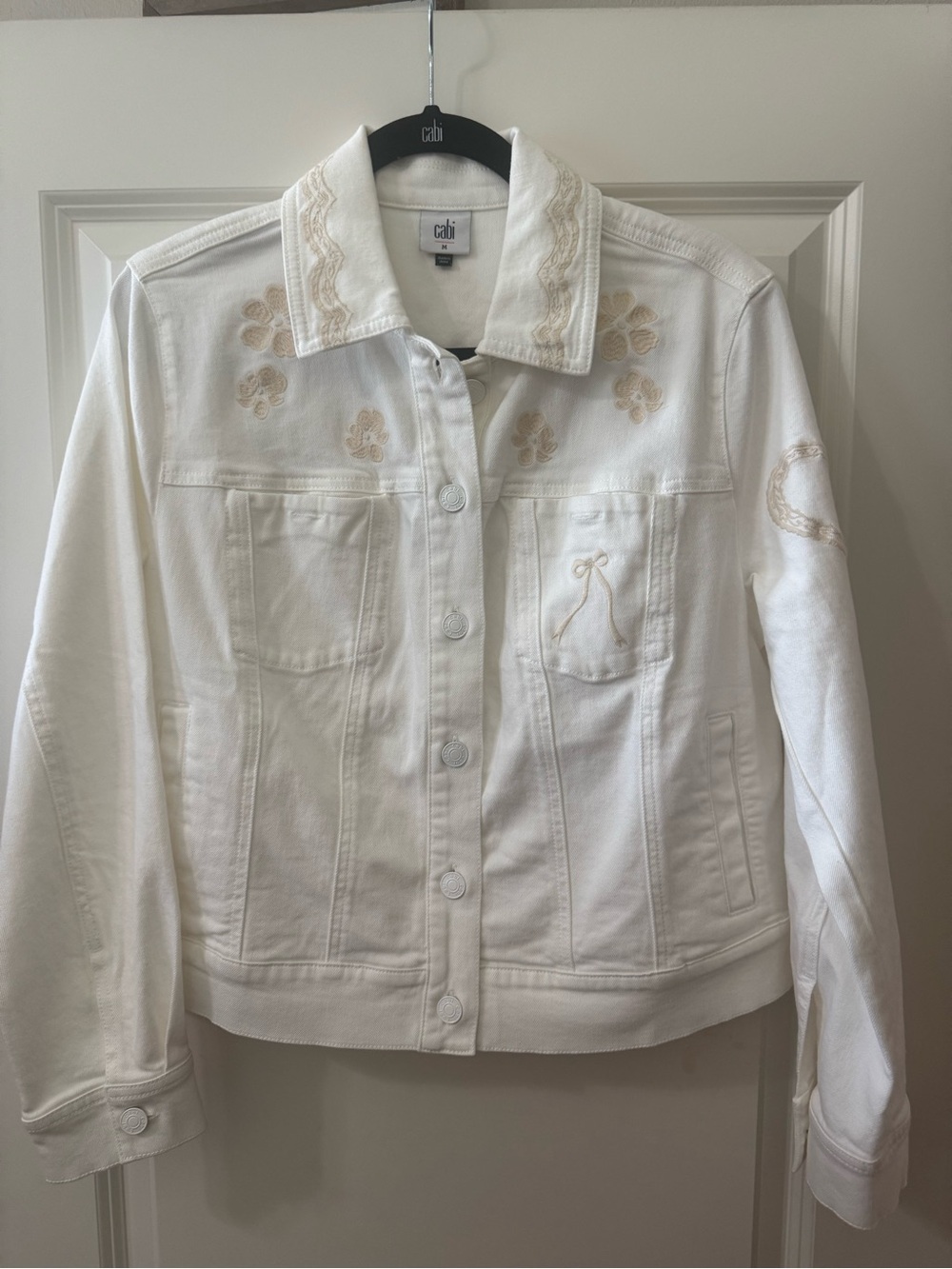 CAbi's "Ladybird Jacket" White Denim Jean Jacket with Cream Embroidery